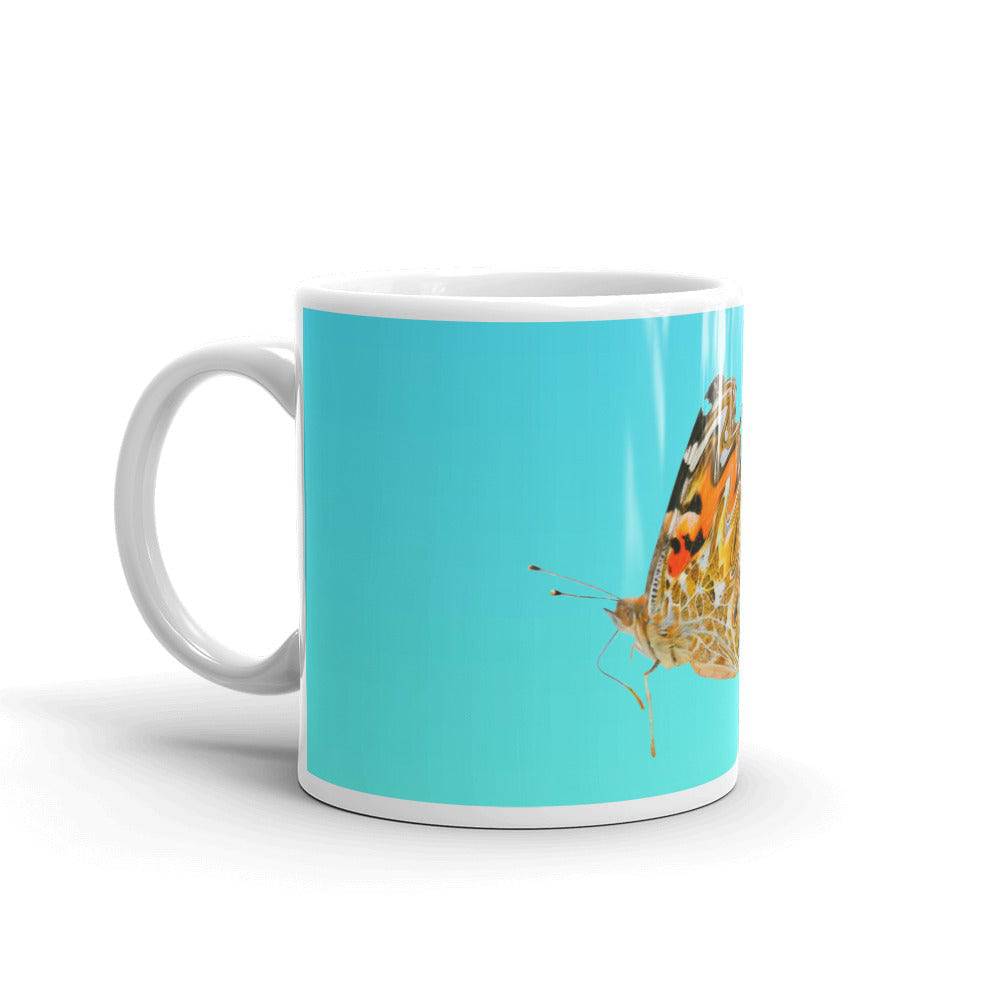 White glossy mug/butterfly in motion - Enet Images