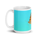 White glossy mug/butterfly in motion - Enet Images