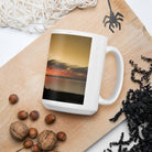 White glossy mug/old tree against the sunset - Enet Images