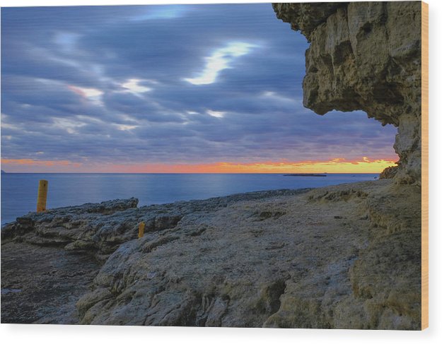 The Big Rock Against The Cloudy Sunset - Wood Print